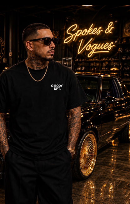 Model wearing the black G-BODY DPT. tee with small white front chest print