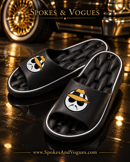 Black lowrider graphic slides in a black and gold garage display