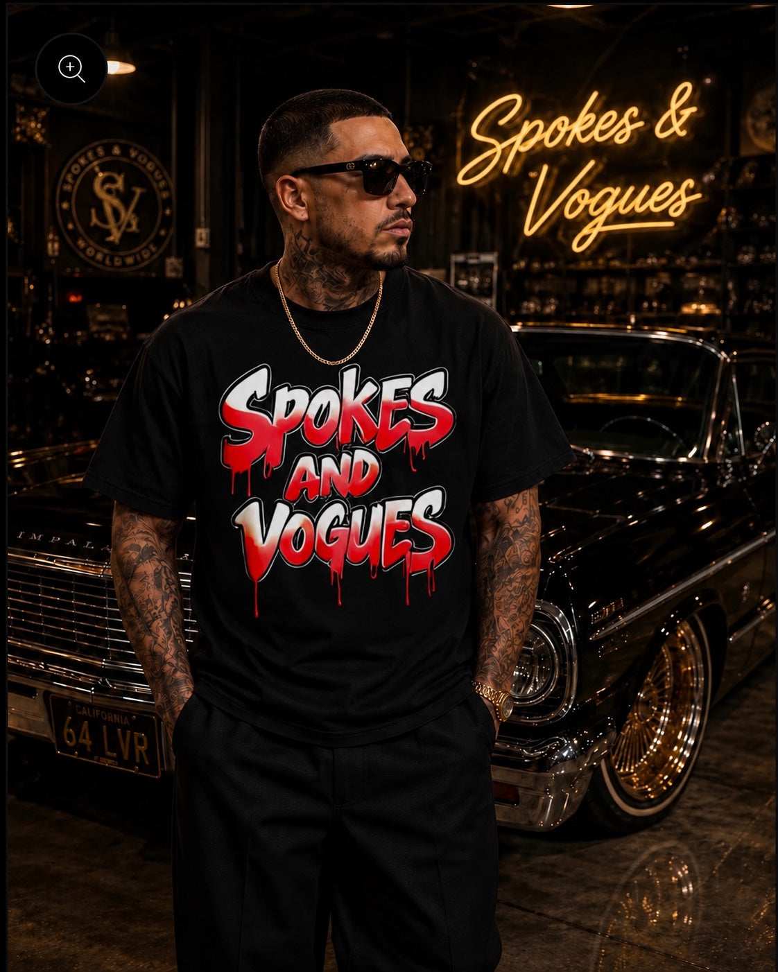 Model wearing Spokes & Vogues red and white drip logo black T-shirt